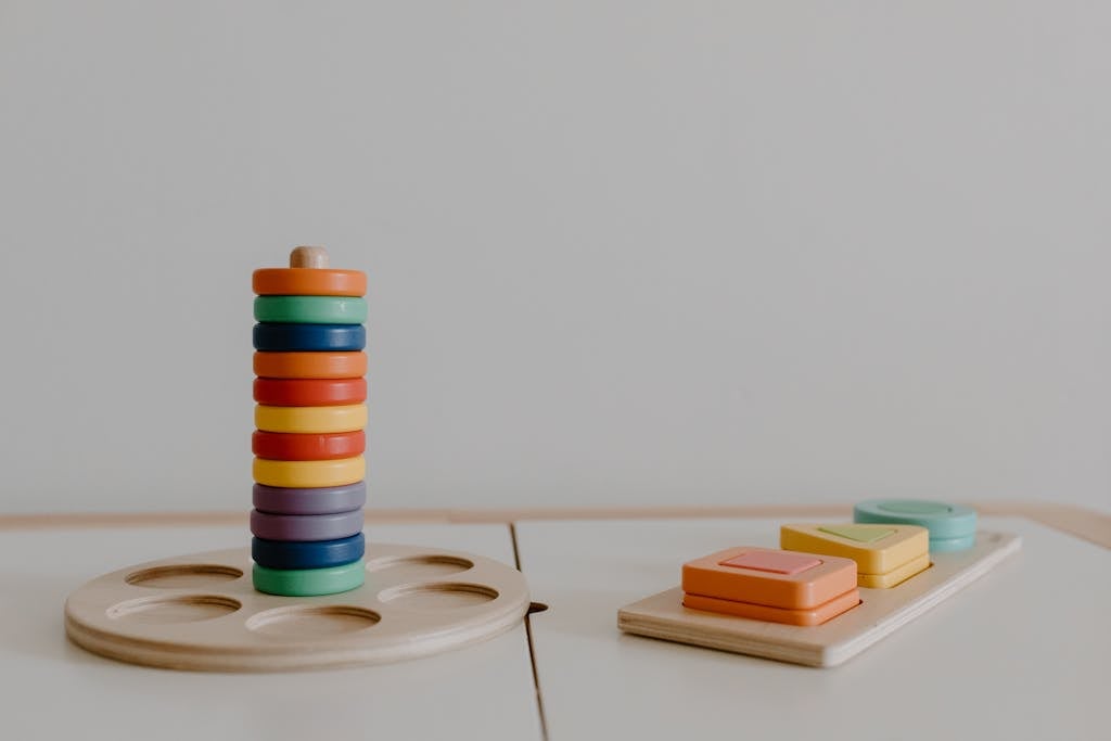 Colorful Wooden Educational Toys Near White Wall